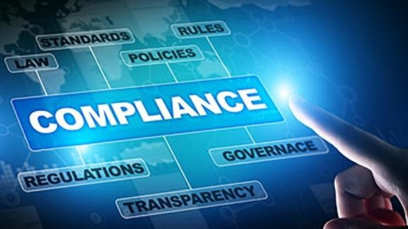 the word Compliance in text with a finger pointing towards it